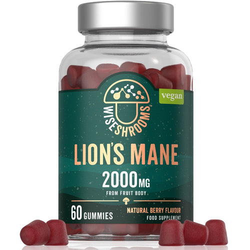 A hand holding Wiseshrooms Lion's Mane 2000mg Vegan Gummies, made from fruit body, with natural berry flavor.