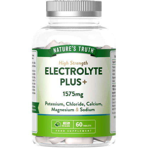 Hand holding 60 vegan tablets of NU Electrolyte Plus, showcasing eco-friendly packaging and supplement for electrolyte balance.