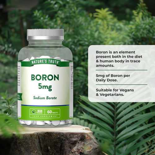 A hand holds a bottle labeled Boron 5mg, containing 60 vegan tablets, emphasizing supplement benefits and vegan-friendly composition.