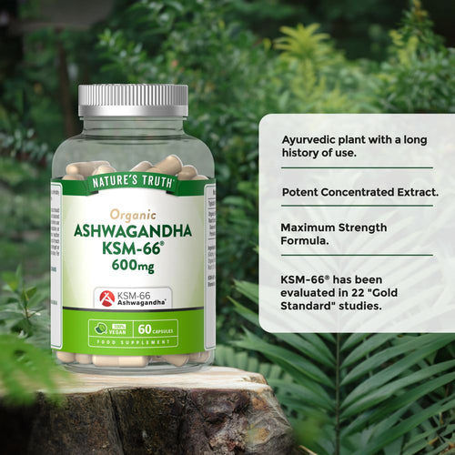 Nature's Truth Organic Ashwagandha KSM-66 600mg capsules, 60 count, in a clear bottle held on a hand scale.