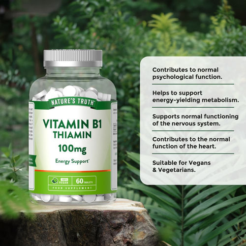 A bottle of 100mg Vitamin B1 Thiamin containing 60 vegan tablets, displayed on a hand scale.