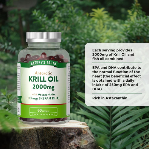 A bottle containing 60 red softgels of Krill Oil, each with a 2000mg dosage, displayed on a hand scale.