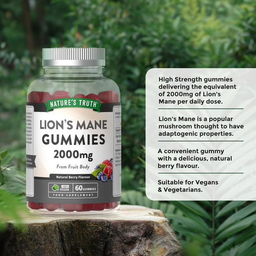 Hand holding a bottle of Lion's Mane Gummies, 2000mg, containing 60 vegan natural berry-flavored gummies.