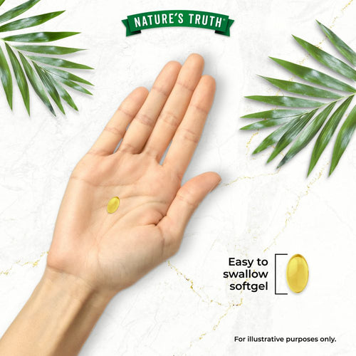 A hand holds a small yellow oval softgel with text reading 'Easy to swallow softgel'.