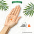 An orange gummy lies in an open hand, with another gummy beside the text 'Vegan friendly gummies'.
