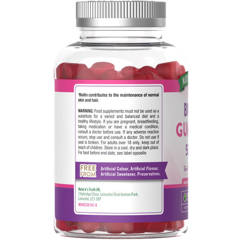 NU Biotin 5000ug 60 Vegan Gummies displayed in a bottle, promoting dietary supplement for hair, skin, and nail health.