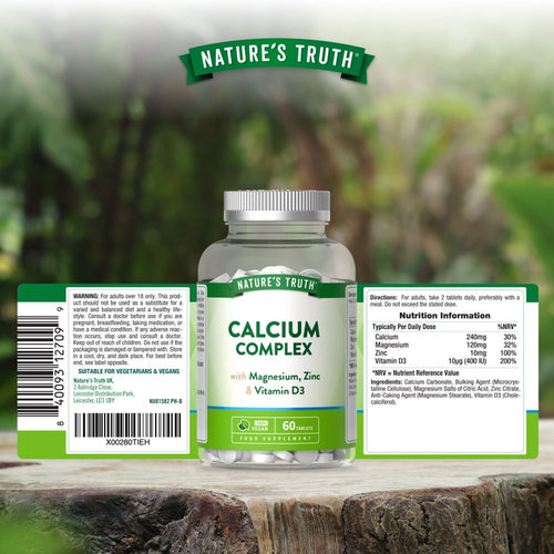 Bottle of Calcium Complex with Magnesium, Zinc, and Vitamin D3 containing 60 tablets, shown next to a hand for size reference.