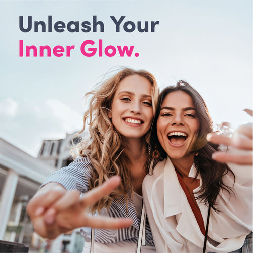 Two young women smiling, making peace signs, holding Super Hyaluronic Acid.