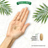 A hand holds a light brown Dandelion 500mg tablet. Another tablet lies beside text reading 'Vegan friendly tablets'.