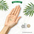 Hand holds a small, round vegan dandelion extract tablet. Text says 'Vegan friendly tablets' next to a larger tablet.