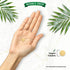 A small, round, yellow vegan tablet rests in the palm of a hand. Graphic on the right reads 'Vegan Tablets'.