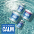 Natural Vitality Calm Original Relaxing Drink Mix in a 200g powder form, shown by a hand for scale.