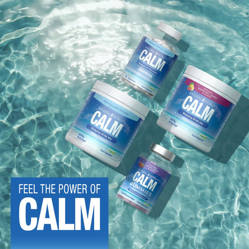 Natural Vitality Calm Original Relaxing Drink Mix in a 200g powder form, shown by a hand for scale.